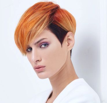 Client with short two-tone hair, red and dark
