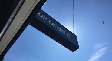 Nelly McNally outside sign