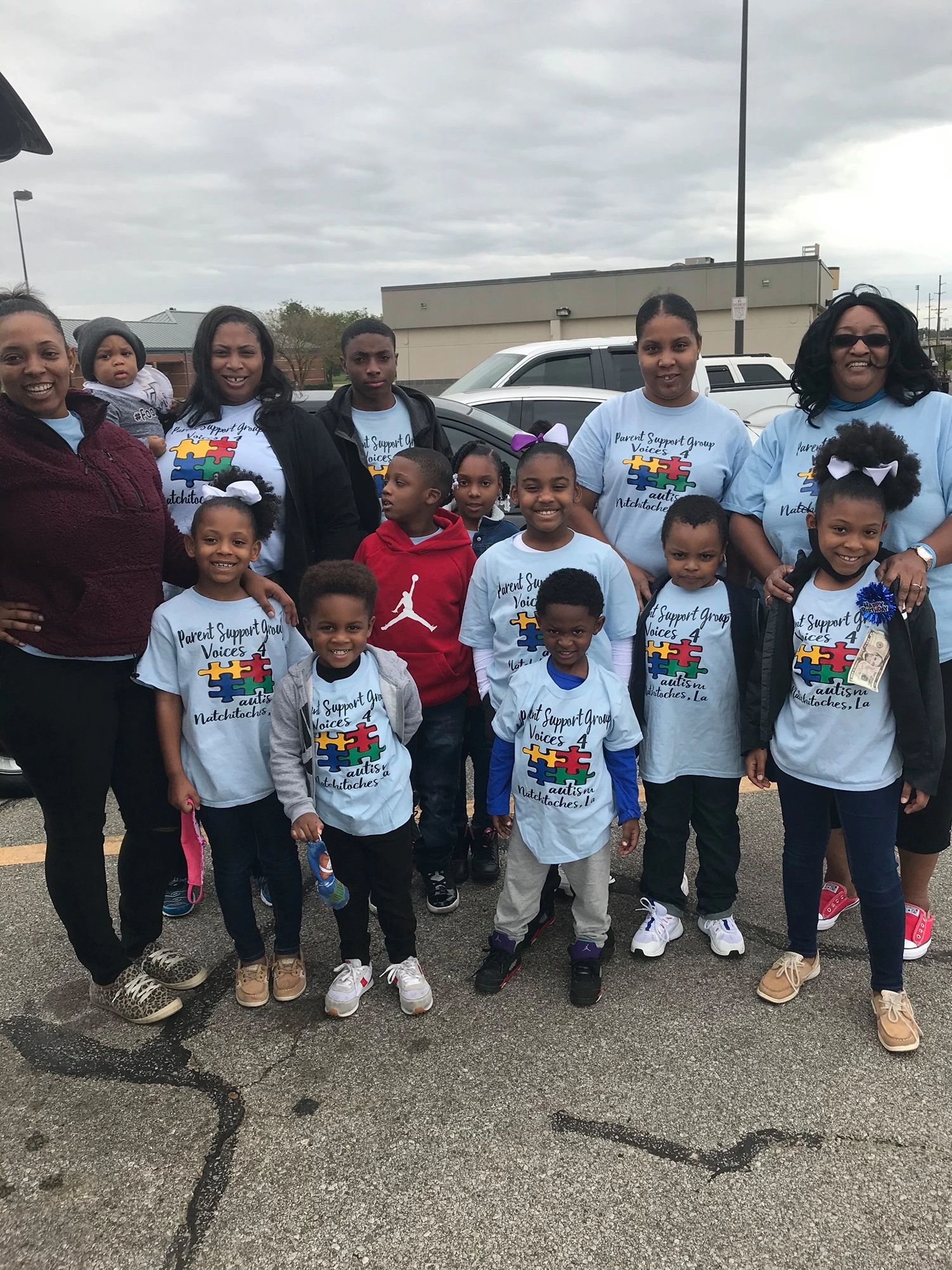 Group of people with Autism awareness shirts on. 