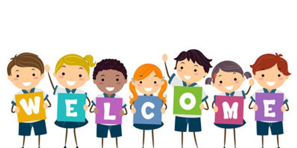 Children holding colorful letters spelling WELCOME.