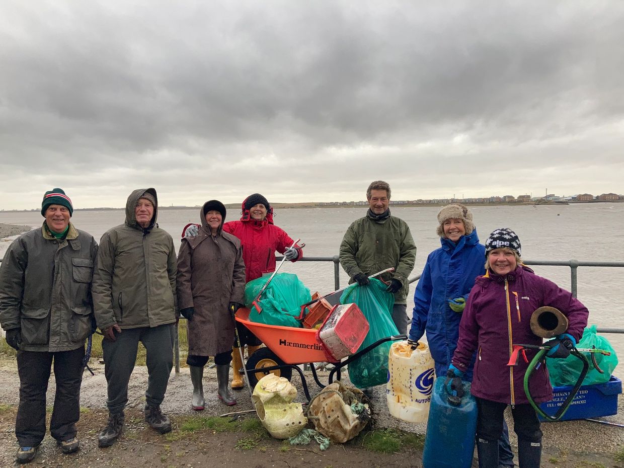 Volunteers gather rubbish on Knott-End Beach