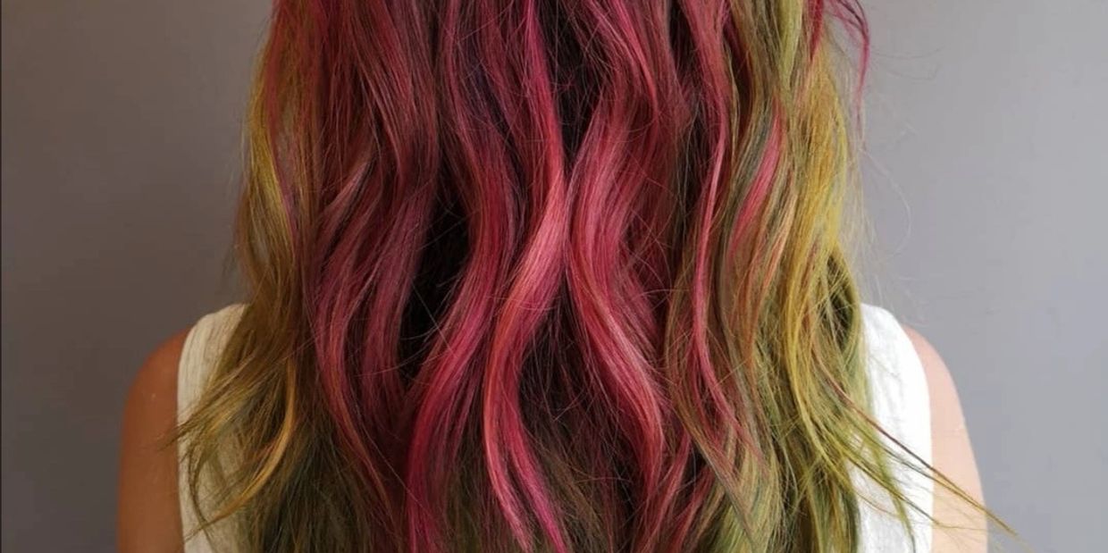 Vibrantly coloured hair. Dusty rose, greens, and yellows.