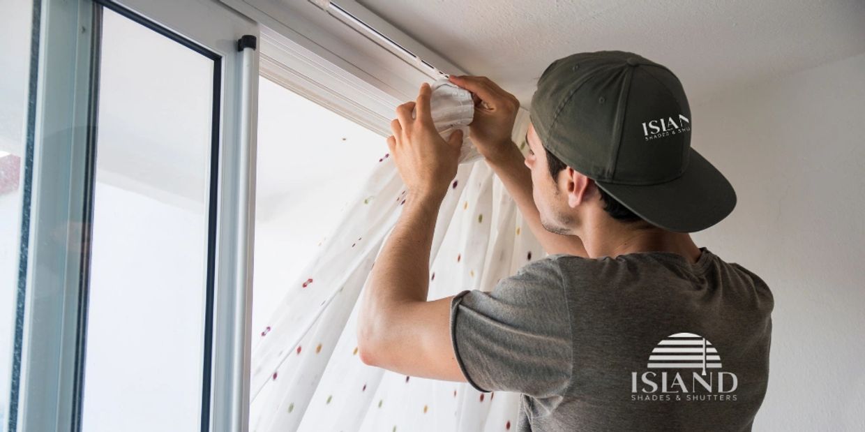 Island Shades man hanging window treatments