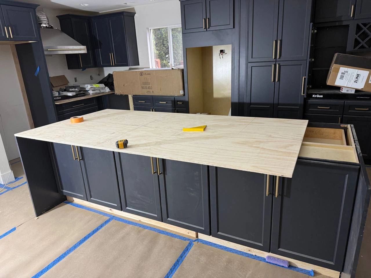 Tacoma kitchen remodeling project with custom dark cabinets in progress by CHR Construction Group