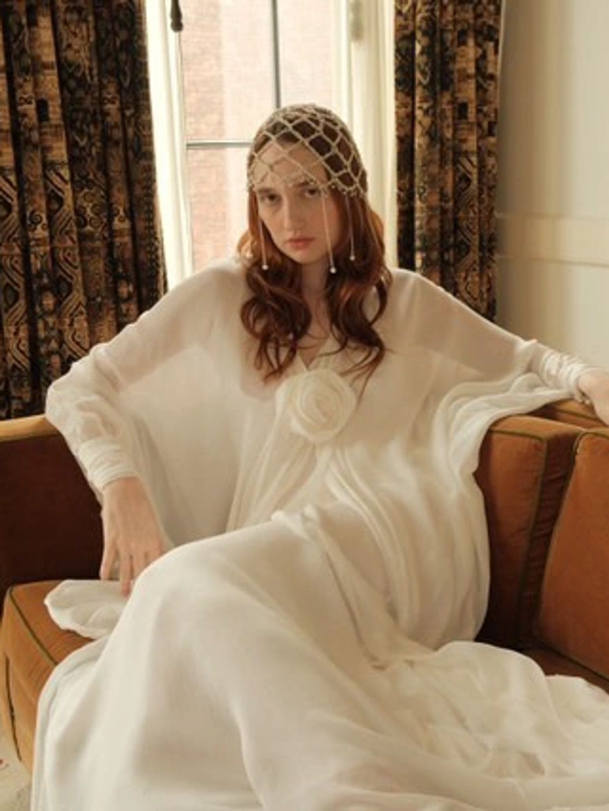 Model Stephanie Smallwood wearing jewelry headpiece paired with Ferrah bridal gown by Lela Christian