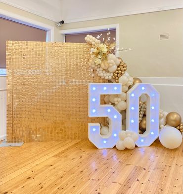 birthday anniversary sequin wall venue decor balloon arch light up numbers East Sussex Brighton 