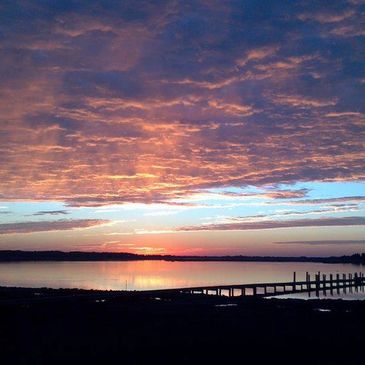 Sunrise on Little Oyster Bay, as seen from the Baywatch Rentals