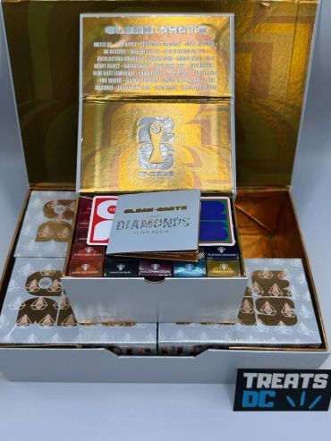 Luxury chocolate gift box with assorted flavors and promotional cards.