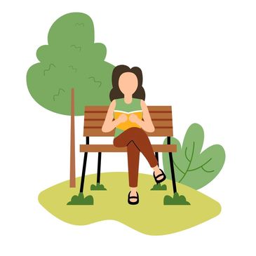 A woman reading a book on a park bench surrounded by trees and plants.