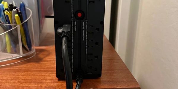 Amazon Basics Line Interactive UPS (10 outlets 1500VA) 900 Watt Surge Protector and Battery Power Ba