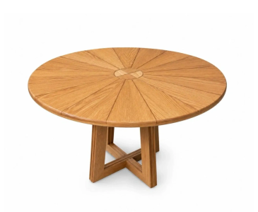 Round wooden table with geometric base.