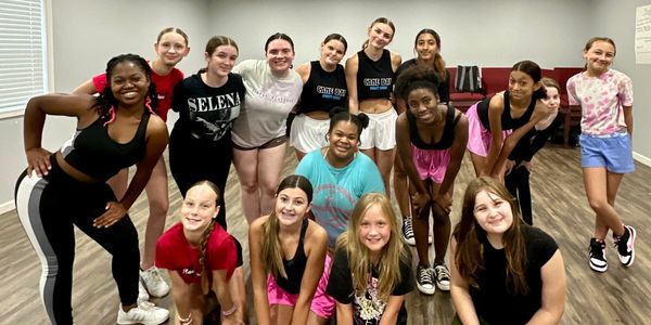 dance class posing together for a picture