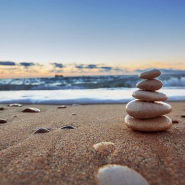 Photo of balanced rocks on seashore