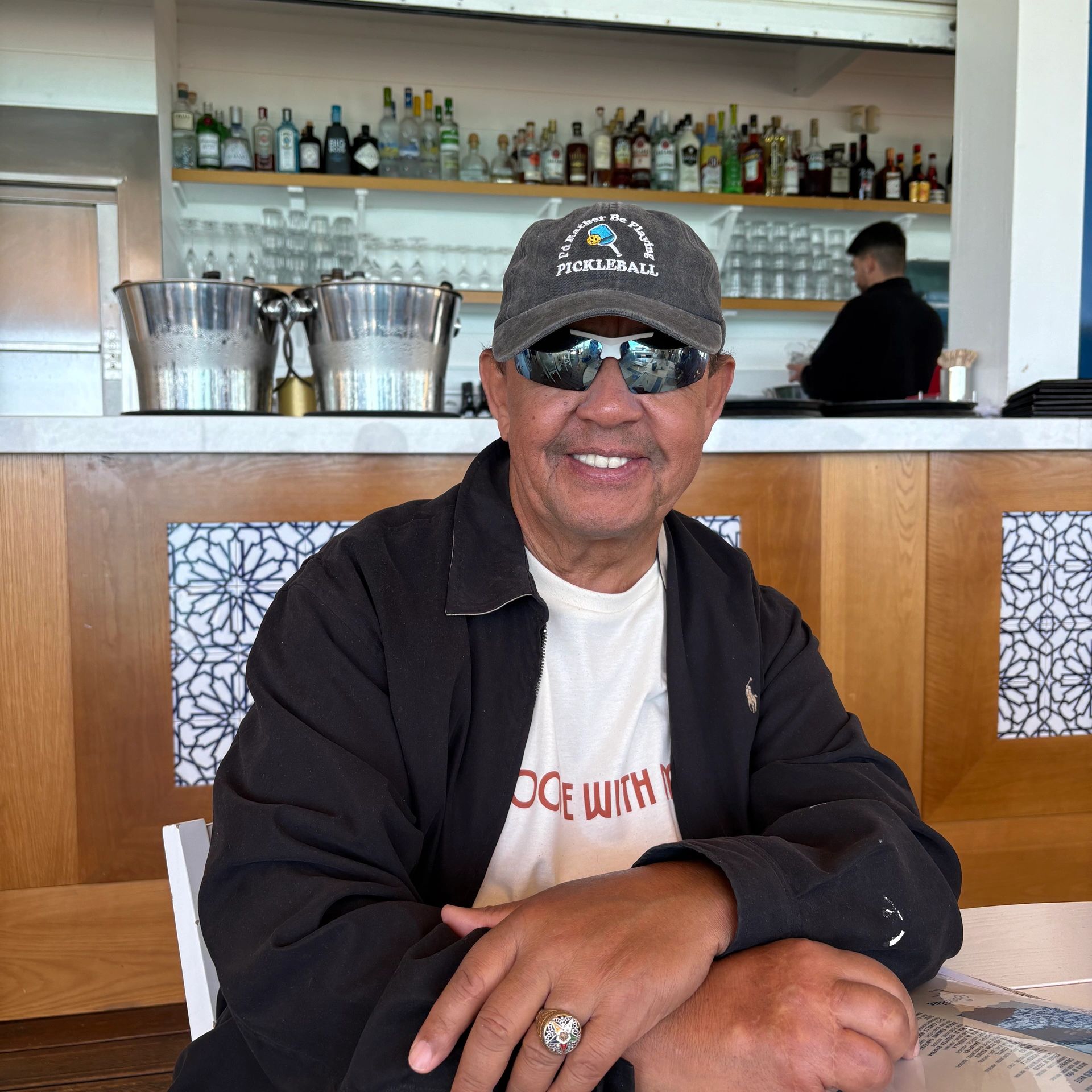 Michael James Anthony having a drink at a restaurant. 