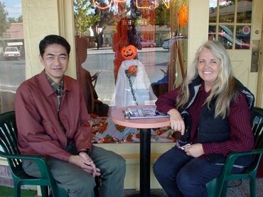 a man and a woman sitting at a table across from each other