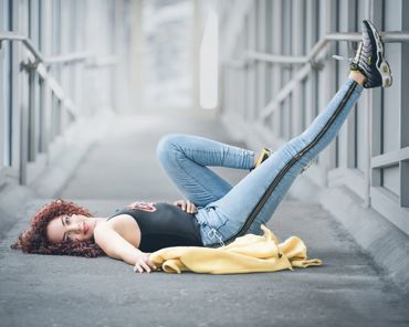woman laying down, yellow jacket