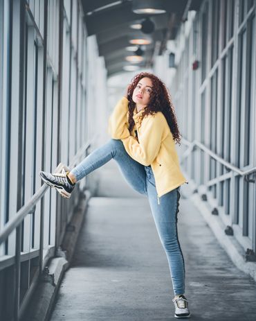 Woman posing, yellow jacket