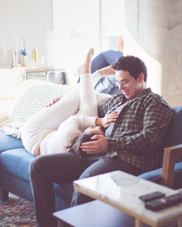 Couple relaxing on a sofa in living room