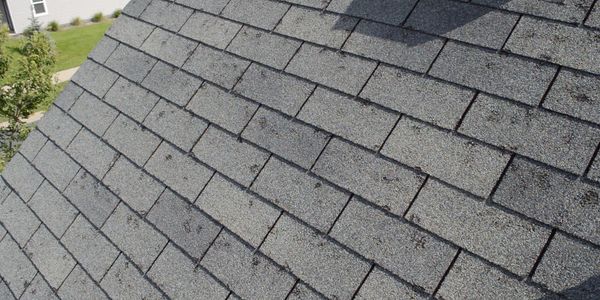 damaged asphalt shingles