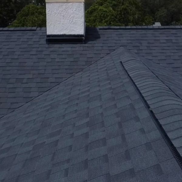 A new moire black Certianteed shingle roof recently installed in Orlando, FL.