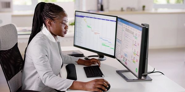 Young business woman checking financial records to budget advertising dollars and bottom line