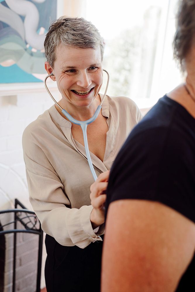 Dr Zuzi wearing a stethoscope-  Zivio Health offers compassionate, root-cause healthcare 
