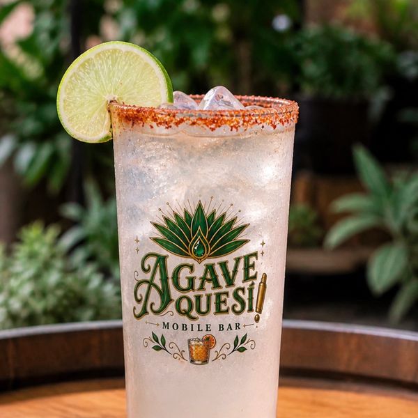 Refreshing cocktail with lime and chili salt rim at Agave Quesi Mobile Bar.
