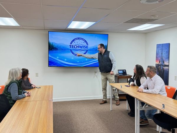 Man giving a presentation to colleagues in a conference room.