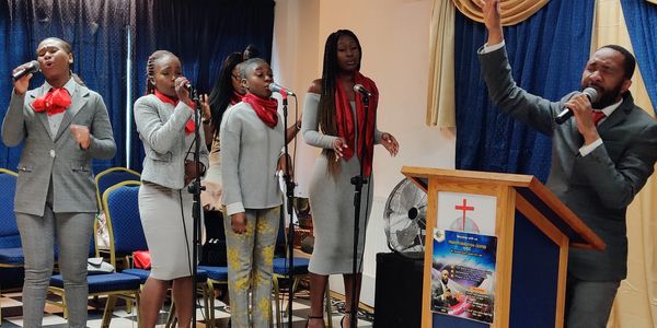 Bishop singing with the choir in the church