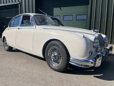 Jaguar Mk2 3.8 manual overdrive. Somewhat "breathed over" went like the clappers and electric pas to