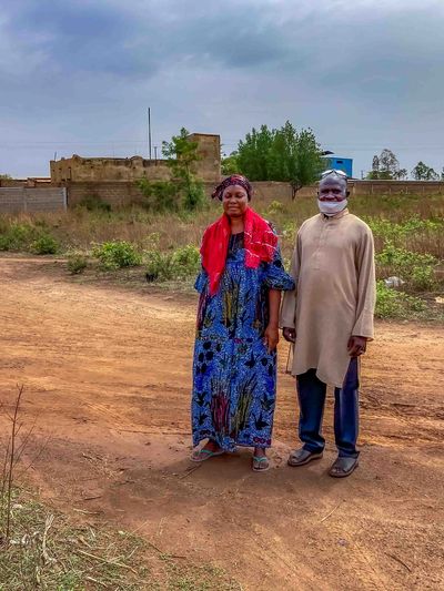 Batoma and Ablo standing on the property that will become their first home.