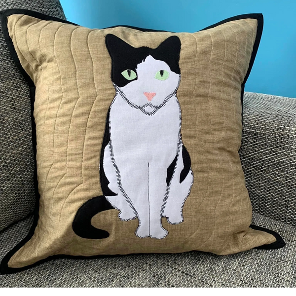 Beige cushion with hand made applique cat