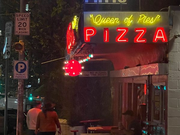 Neon sign of Homeslice Pizza on South Congress. 