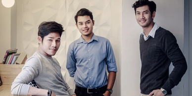 Three young men posing confidently indoors with casual and business attire.
