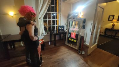Guests using the magic mirror photo booth