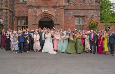 all wedding guests having their photo taken at Walton Hall Warrington