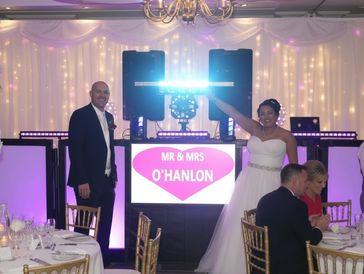 Wedding couple in front of dj setup