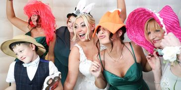 group of wedding guests in photo booth