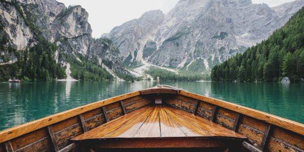 View from a wooden boat on a mountain lake.