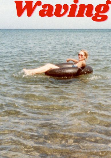 Person relaxing on an inflatable tube in the sea.
