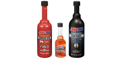 Three AMSOIL fuel additives in red, clear, and black bottles.