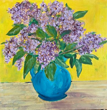 Purple lilacs in a blue vase against a bright yellow background.