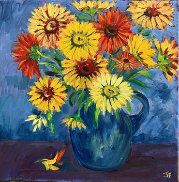 Colorful flowers in a blue pitcher on a blue and purple background.