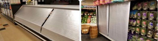 Grocery store refrigeration units covered with metal panels.