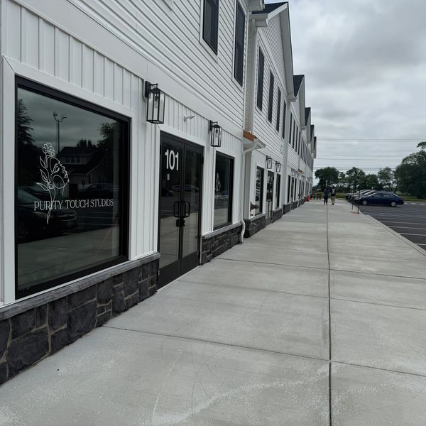 The building, store front. 