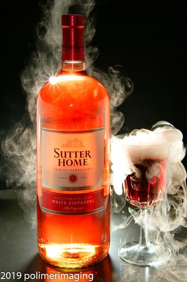 Sutter Home wine bottle and a glass 