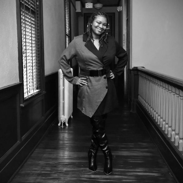 "Portrait of Capricia Griffin, first-time author and advocate for self-healing, smiling confidently and exuding warmth and strength