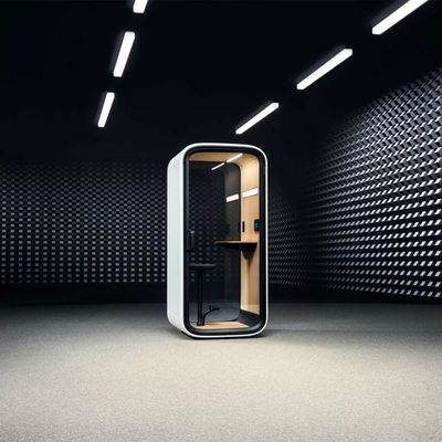 A sleek, modern phone booth in a futuristic, geometric room.