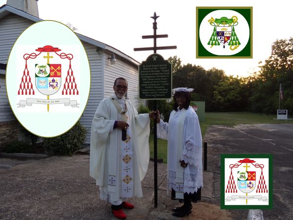 Two clergy members standing next to a historical marker outside a building.