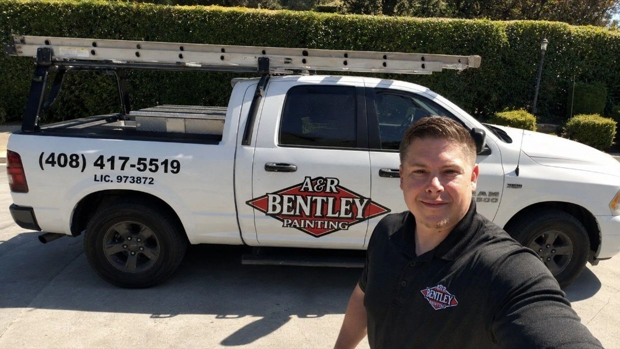 A&R Bentley Painting branded work truck loaded with ladders at a San Jose job site